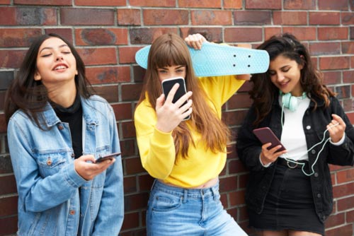 young women with phones